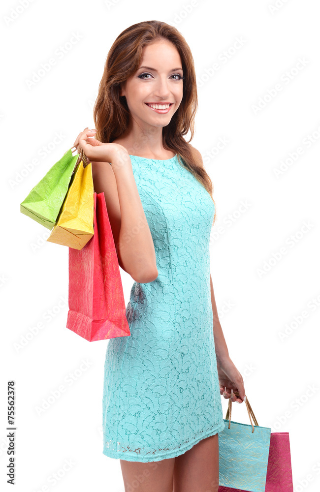 Beautiful young woman with shopping bags isolated on white Beautiful young woman with shopping bags isolated on white