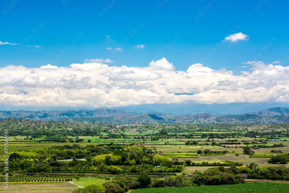 Countryside with blue sky and mountains