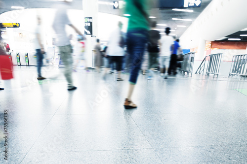 passengers walking in rush hour at subway station