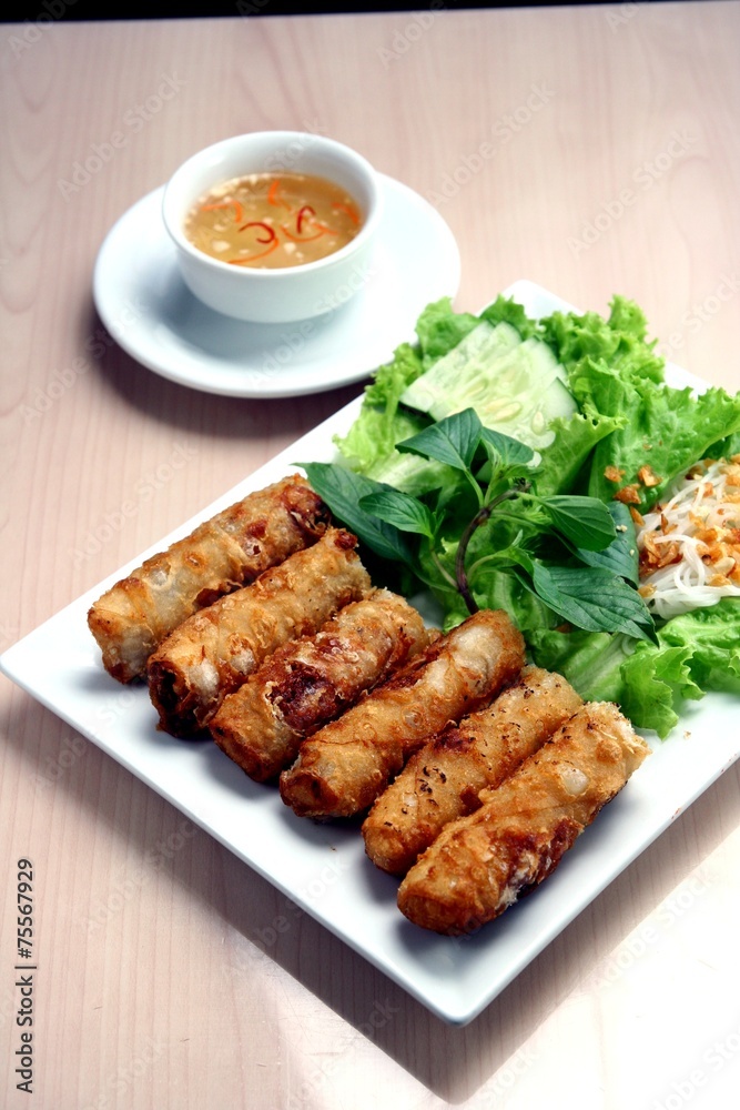 Spring rolls and vegetables. Asian food.