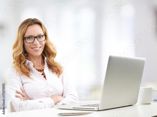 Mature business woman with laptop