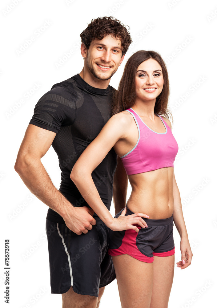 Athletic man and woman after fitness exercise on the white Athletic man and woman after fitness exercise on the white