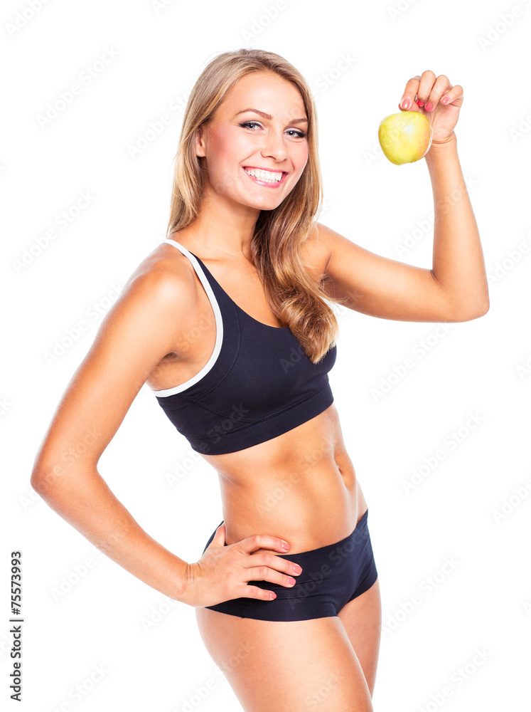 Young smiling girl holding green apple in hand Young smiling girl holding green apple in hand