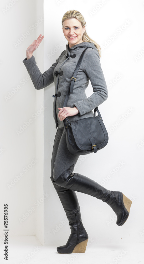 woman wearing platform black boots with a handbag woman wearing platform black boots with a handbag