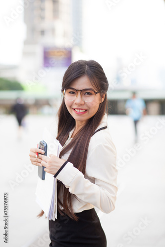 Happly asian businesswoman hold paper.