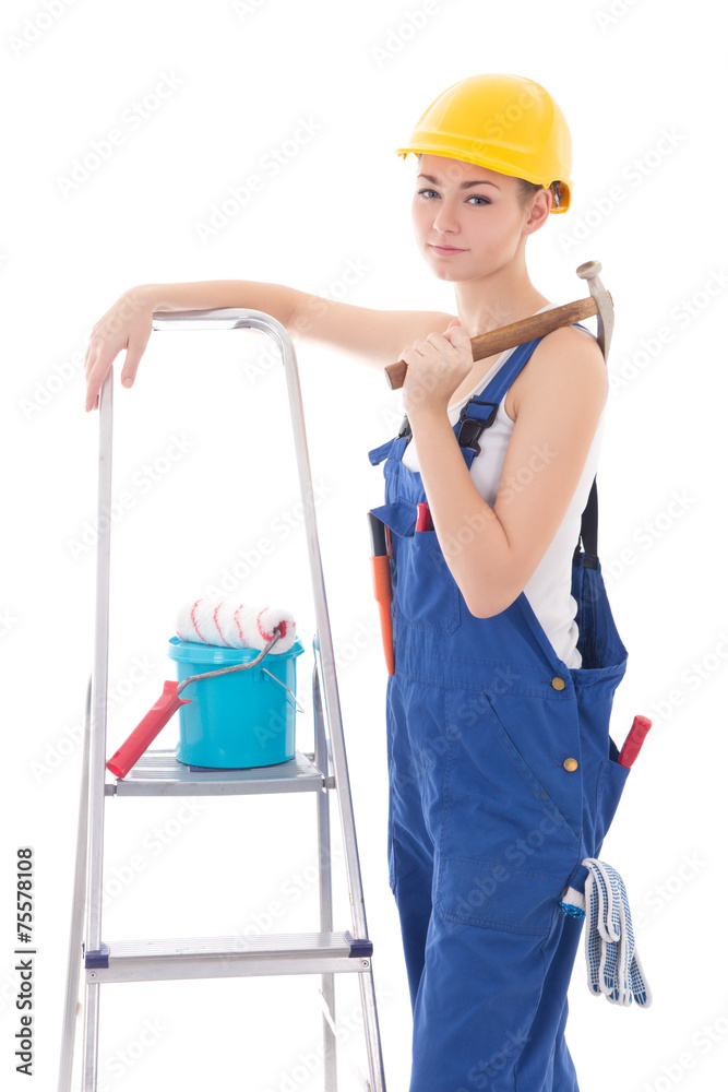 young beautiful woman in blue coveralls with builder's tools and young beautiful woman in blue coveralls with builder's tools and
