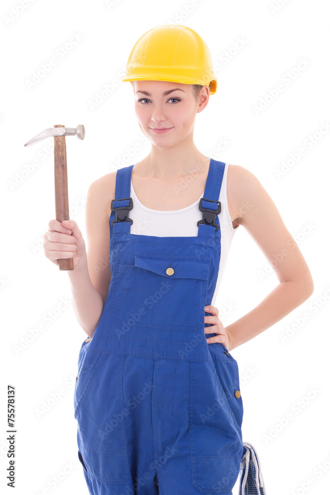young beautiful woman builder in blue coveralls with hammer isol