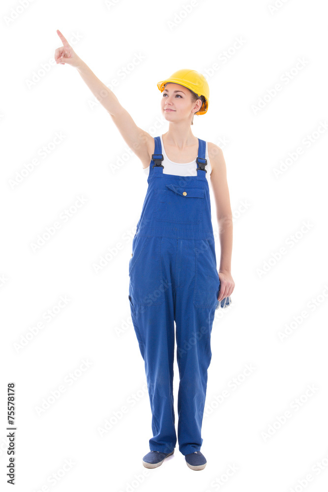young woman builder pointing at something isolated on white young woman builder pointing at something isolated on white