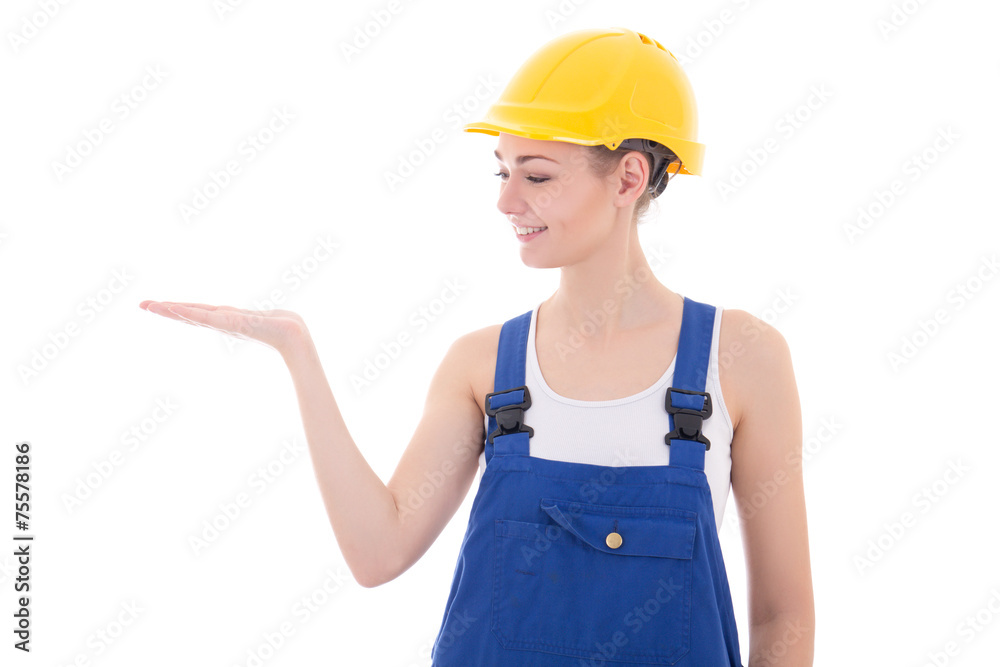 young attractive woman builder holding something in hand isolate young attractive woman builder holding something in hand isolate