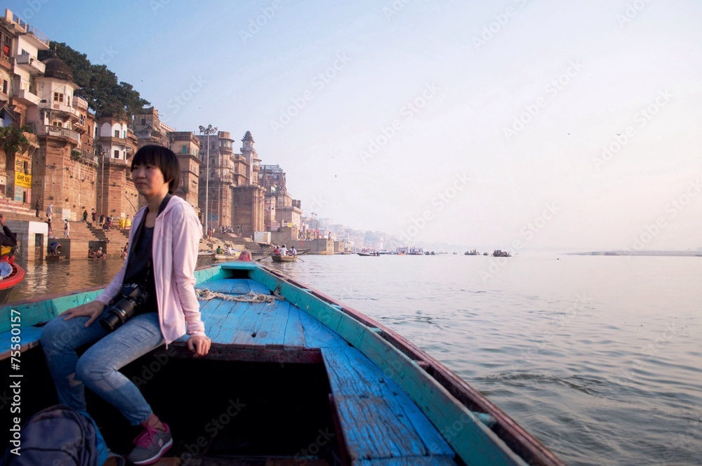 Woman on the boat at Ganga river, Varanasi, india