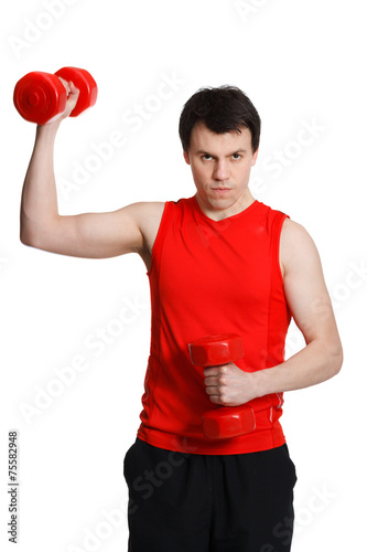 sporty man with dumbbells in the hands