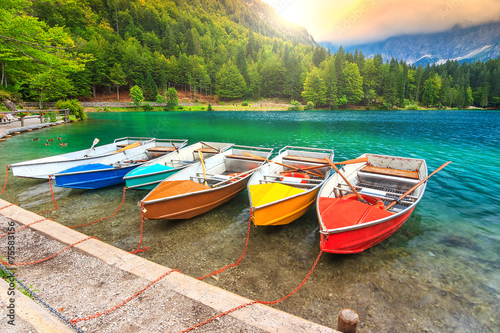 Wonderful alpine landscape and colorful boats,Lake Fusine,Italy
