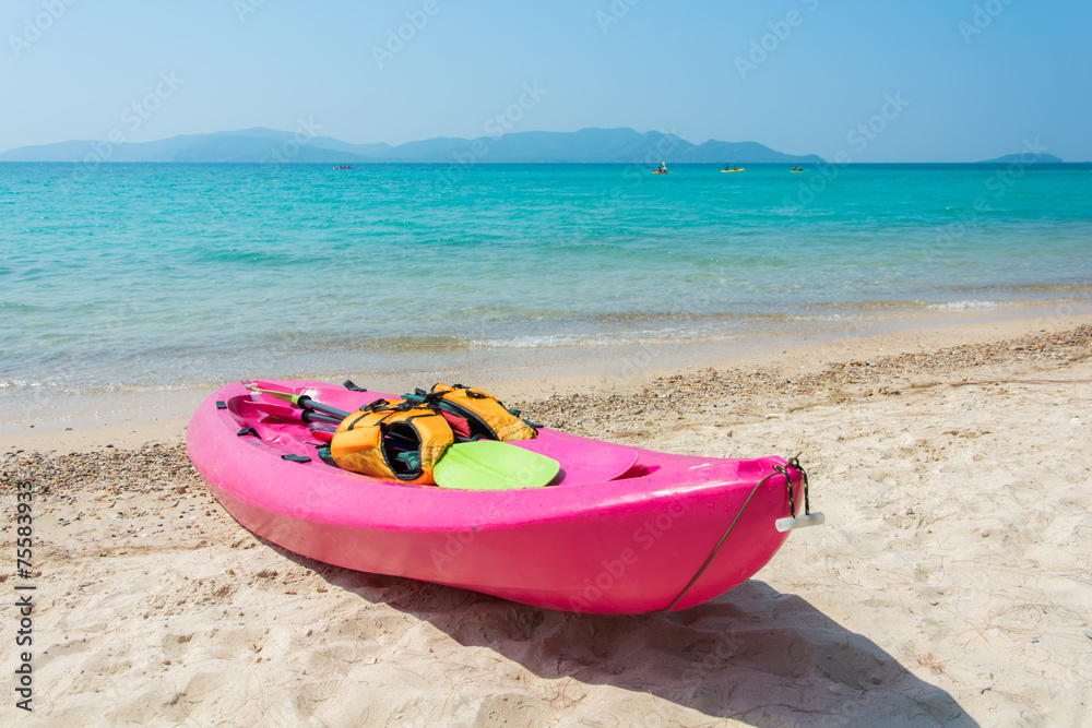 Colorful kayak on tropical beach Colorful kayak on tropical beach