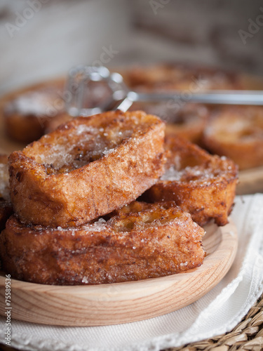 French toasts on a wooden plate. photo