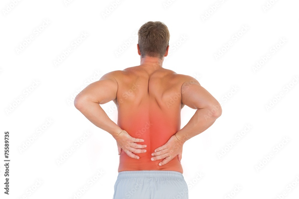 Shirtless man suffering from lower back pain Shirtless man suffering from lower back pain