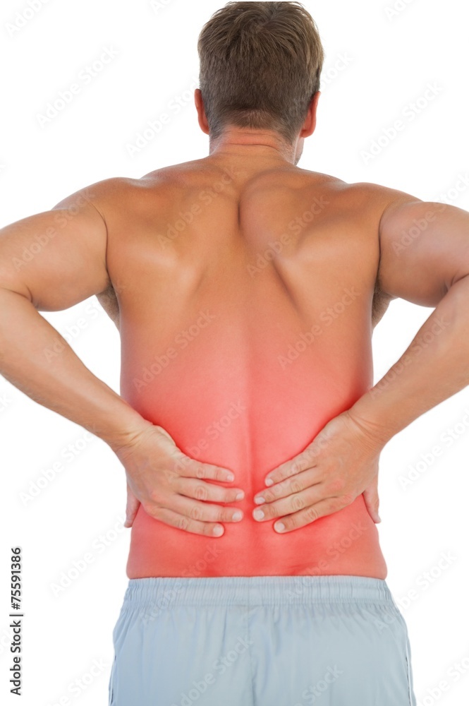 Shirtless man suffering from lower back pain