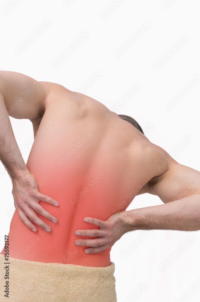 Naklejka premium Rear view of shirtless man with back pain
