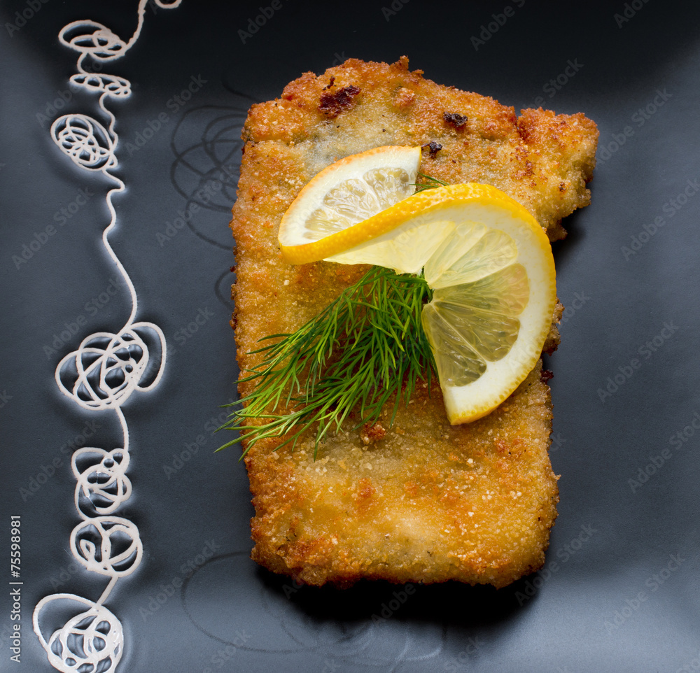 Christmas, fried carp with lemon