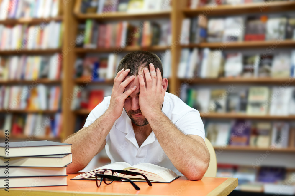 Tired man sleeping in the library Tired man sleeping in the library