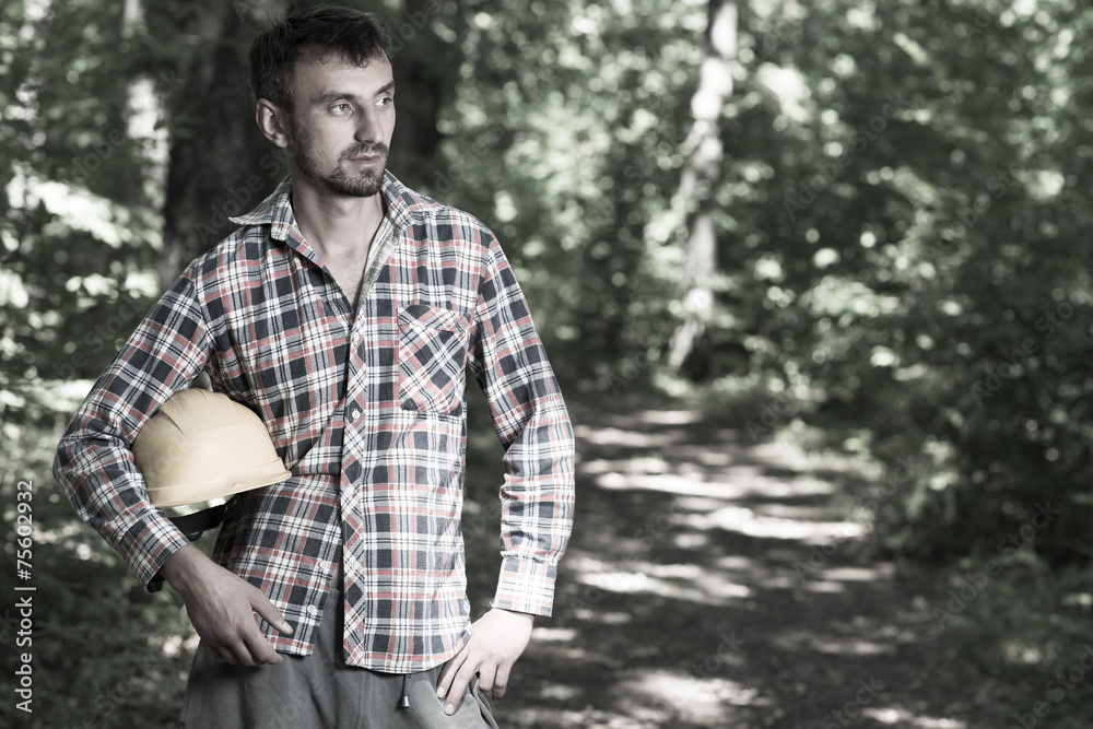 A man in a helmet in the forest helmet. A man in a helmet in the forest helmet.