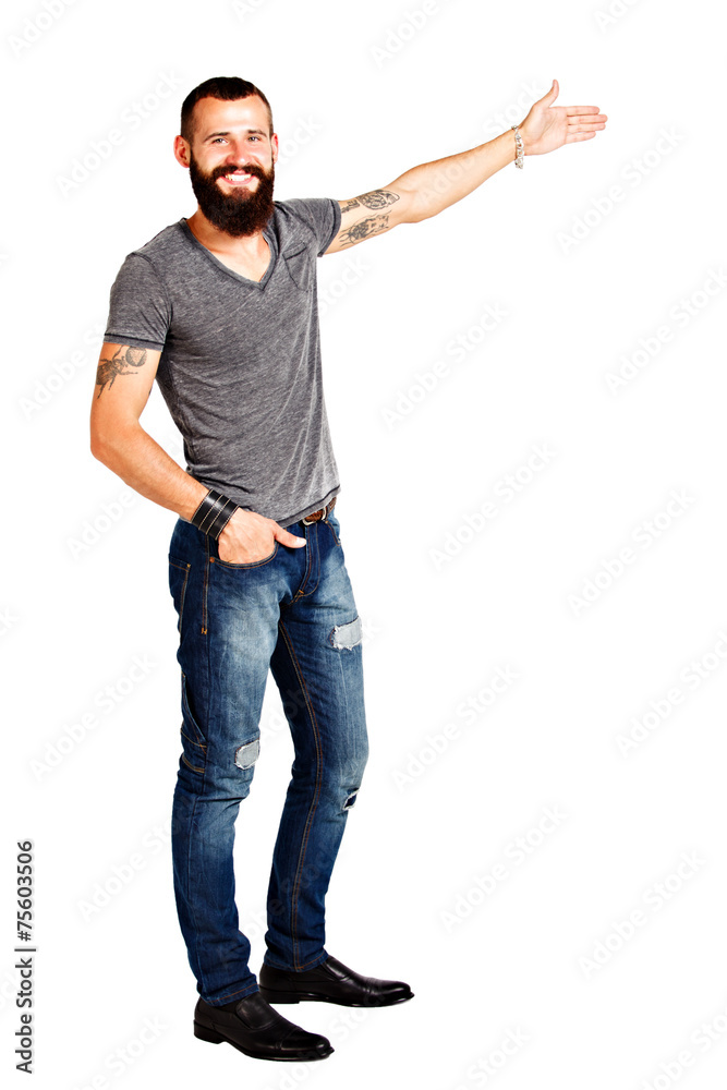 Happy Tattooed bearded man presenting and showing with copy spac Happy Tattooed bearded man presenting and showing with copy spac