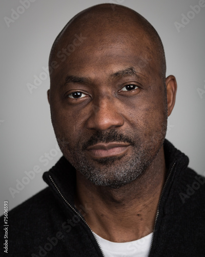 Bald Unshaven Black Man In His Forties