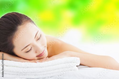Young  woman getting spa treatment over white background