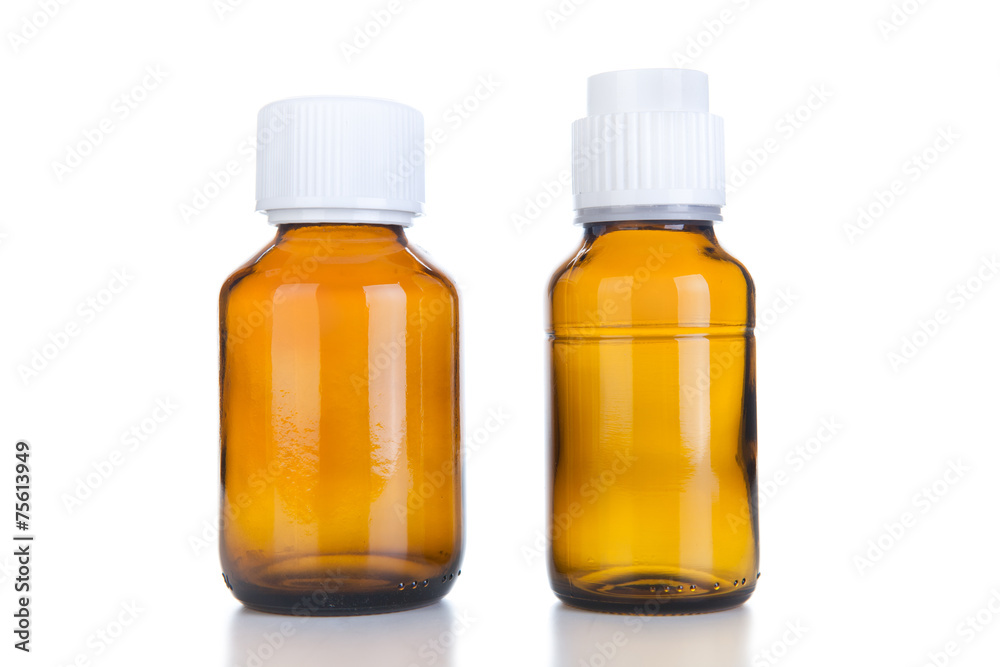 Two Medicine bottle of brown glass or Plastic isolated on white Two Medicine bottle of brown glass or Plastic isolated on white