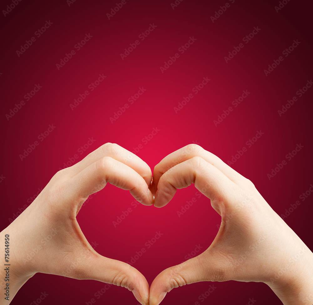 Fototapeta premium Heart hand red background