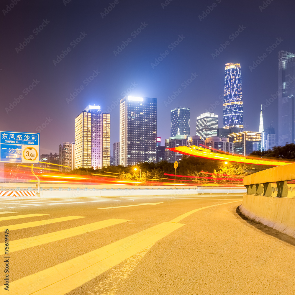 Obraz premium city road with modern buildings at night