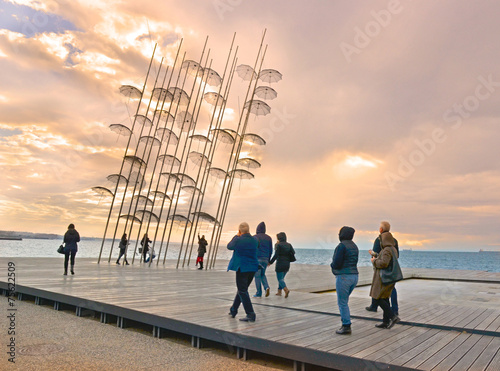 Thessaloniki, port, umbrellas, people, sunset photo