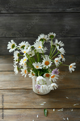 white daisies in a jar