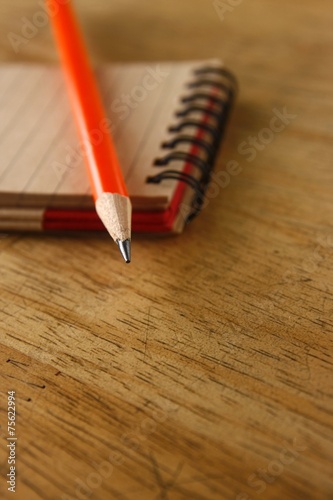 Pencil and a notebook on a table