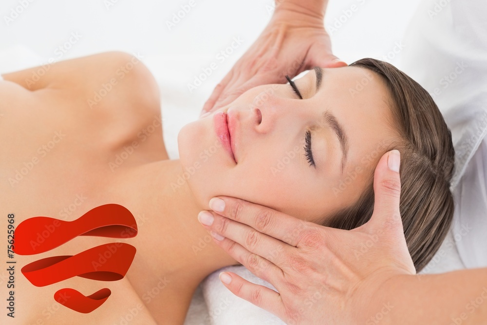 Attractive young woman receiving facial massage Attractive young woman receiving facial massage