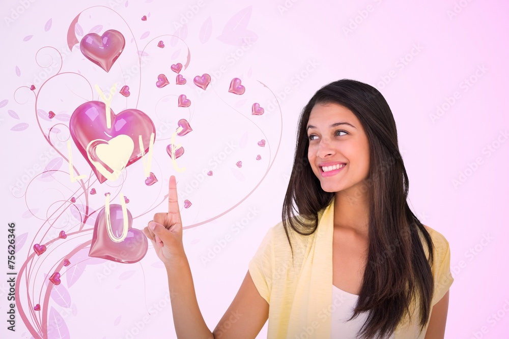 Composite image of happy casual woman pointing up Composite image of happy casual woman pointing up