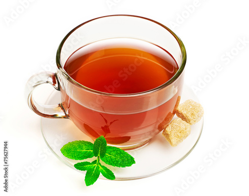 Cup of tea with mint and sugar