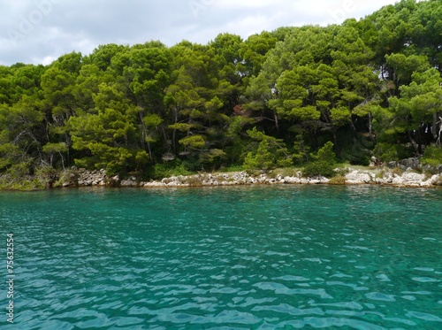 Azure blue water in the bay of Brbinje at Dugi Otok