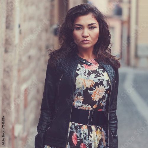 Beautiful asian woman in a smal italian city