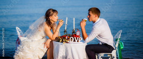 happy bride and groom on the beach