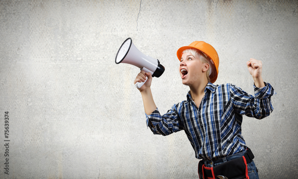 Fototapeta premium Woman builder with megaphone