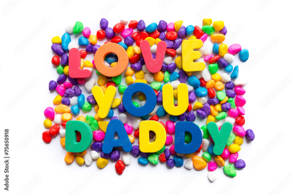 Fototapeta premium love you daddy word in colorful stone