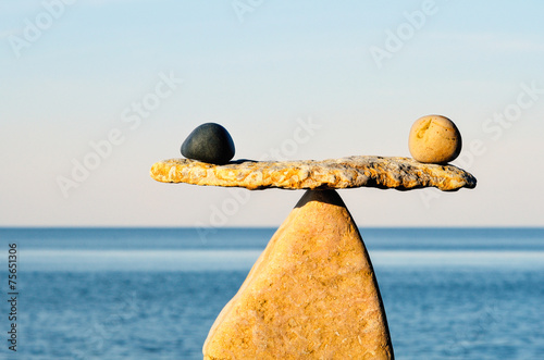 Symbol of Scales on the seashore