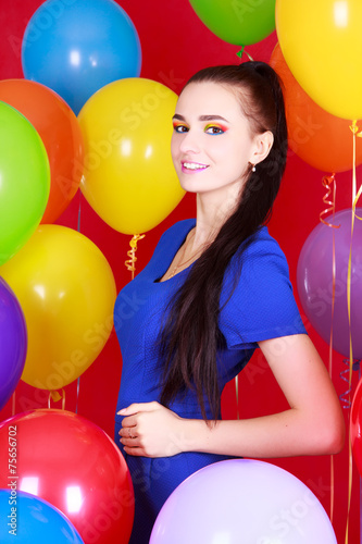 Portrait of a young attractive woman among many bright balloons © art_zzz