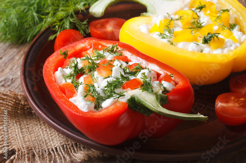 Halved fresh peppers filled with curd and dill close-up