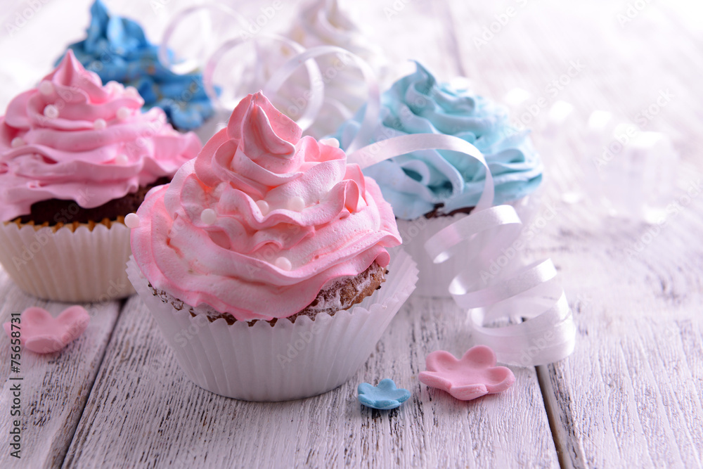 Delicious cupcakes on table close-up Delicious cupcakes on table close-up