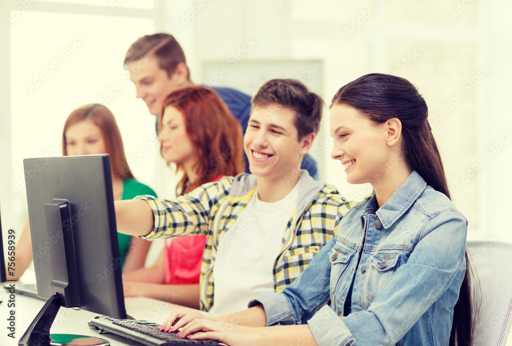 female student with classmates in computer class female student with classmates in computer class