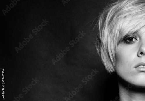 Wallpaper Mural Blonde girl with a short stylish haircut on a dark background Torontodigital.ca