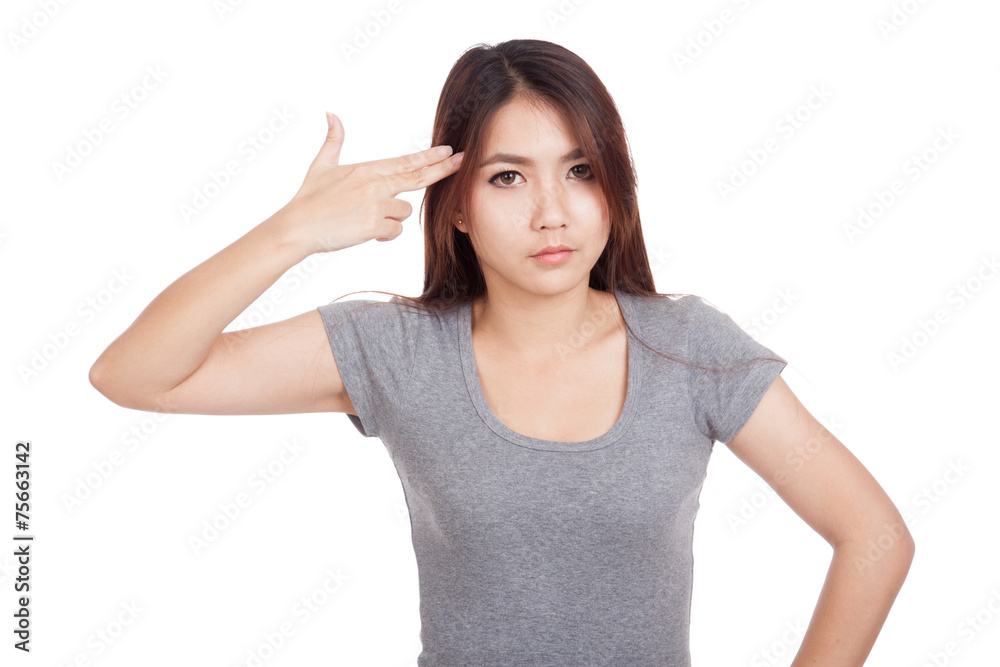 Young Asian woman gesturing gun to head Young Asian woman gesturing gun to head