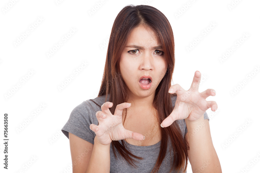 Young Asian woman with spooky hands gesture Young Asian woman with spooky hands gesture