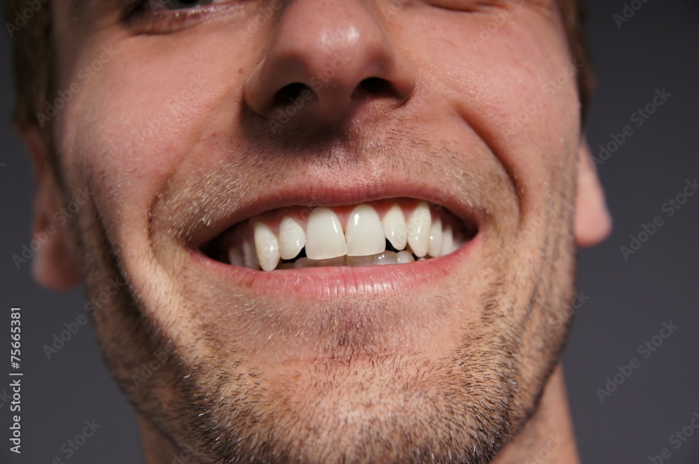 Smiling from young man close up Smiling from young man close up